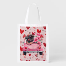 Chien dans une voiture avec le coeur