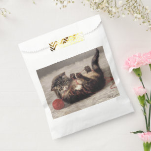 Sachets En Papier Berceau de chat, un chat jouant avec une pelote de