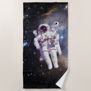 SERVIETTE DE PLAGE ASTRONAUTE FLOTTANT DANS L'ESPACE ÉTOILÉ