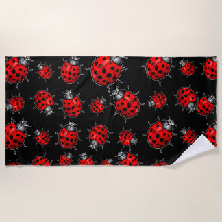 Serviette de plage aux coccinelles