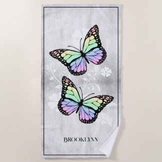 Serviette de plage fleurie à papillon arc en ciel