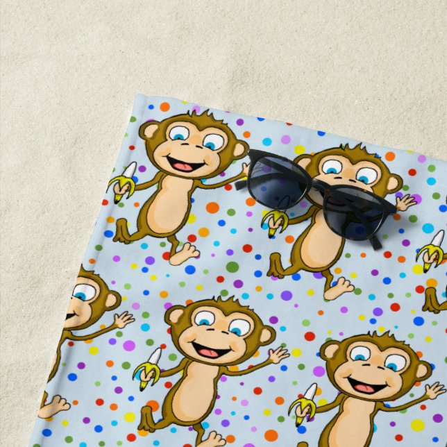 Serviette de plage heureuse de singe (En situation)