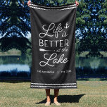 Serviette De Plage Personalized Life Is Better At The Lake<br><div class="desc">Upgrade your outdoor setup at your lakeside abode with this cute personalized beach towel featuring the phrase "life is better at the lake" in white lettering accented with an anchor and an oar. Personalize with your family name and/or year established beneath. Perfect for lake house housewarming parties, summer homes, or...</div>