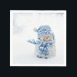 Serviette En Papier Cute Snowman au photographe de Christmas<br><div class="desc">Des serviettes en papier avec une jolie photo d'un petit bonhomme de neige. Debout dehors en hiver avec de la neige qui tombe tout autour. Ce mignon petit gars est habillé en casquette tricoté bleu et foulard.</div>