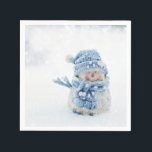 Serviette En Papier Cute Snowman au photographe de Christmas<br><div class="desc">Des serviettes en papier avec une jolie photo d'un petit bonhomme de neige. Debout dehors en hiver avec de la neige qui tombe tout autour. Ce mignon petit gars est habillé en casquette tricoté bleu et foulard.</div>