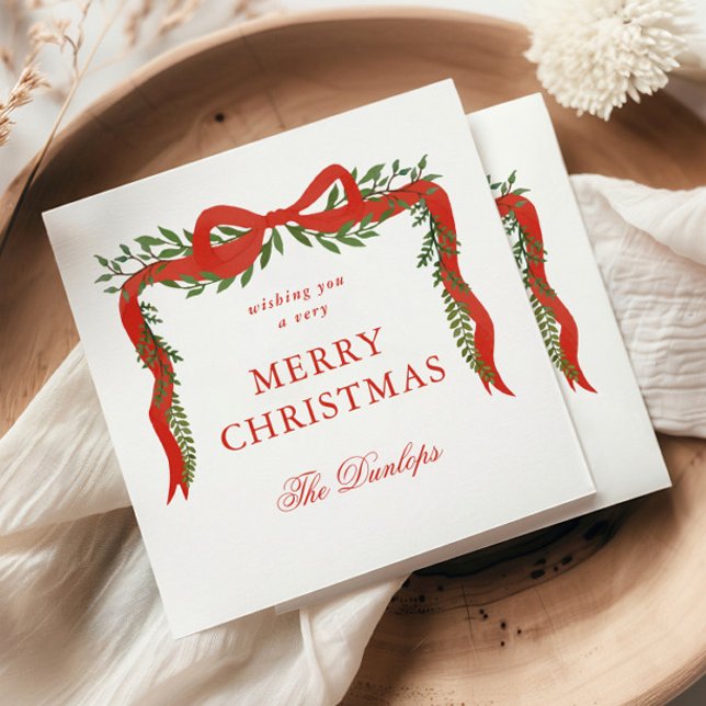 Serviette En Papier Fête de Noël Rouge Ruban Bow (Elegant red ribbon with bow and greenery Christmas holiday party napkins.)