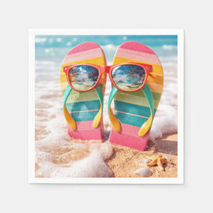 Serviette En Papier Lunettes de soleil sur tongs dans le sable de la p