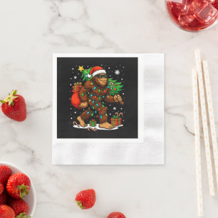 Serviette En Papier Père Noël Bigfoot drôle portant un arbre de Noël