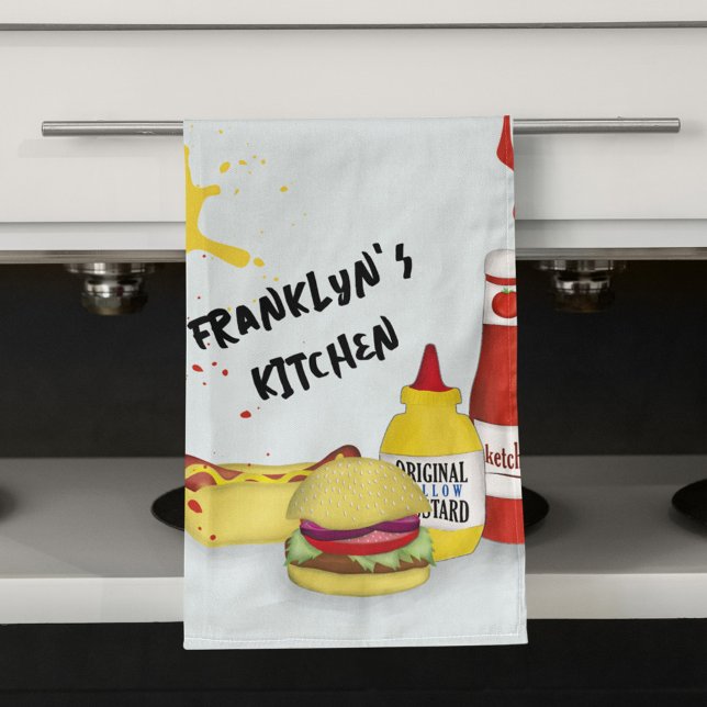 Serviette personnalisée Cool Kitchen BBQ | Grill p (Personalized BBQ kitchen towel hanging on oven with burger, hot dog, ketchup and mustard design.)