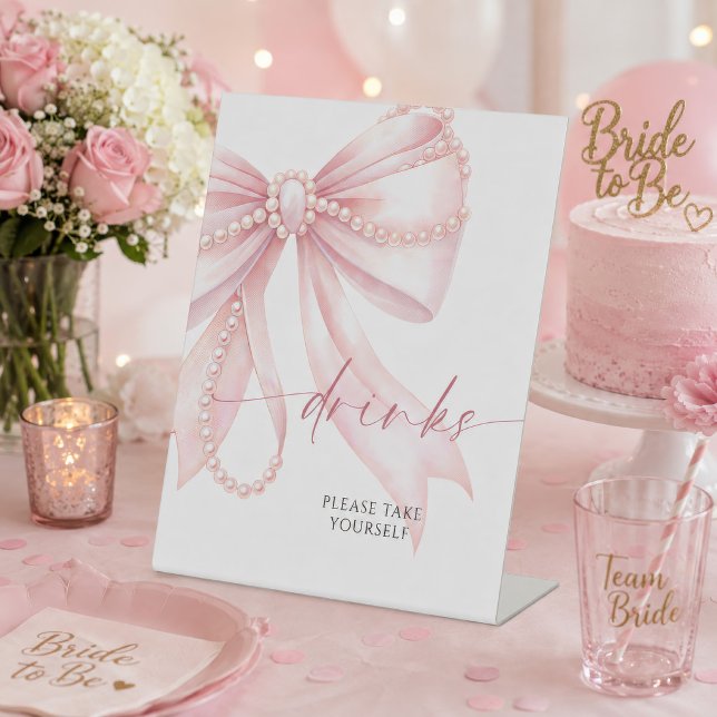 Signe De Table Boissons à l'Arc Rose Perlé  (Pearl pink bow drinks sign displayed at a bridal shower with pink decor and cake)