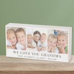 Signe En Bois Grandma Love You 3 Photo Collage<br><div class="desc">Élégante boîte en bois de keepsaké pour célébrer la meilleure grand-mère jamais avec un collage photo de ses petits-enfants,  leurs noms dans la simple typographie moderne,  et "We Love You Grandma" dans la typographie serif classique. Personnalisez si elle est appelée grand-mère,  nana,  grammy,  etc.</div>