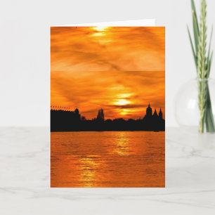 Silhouette de ville au coucher du soleil Carte de