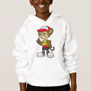 Singe comme joueur de basket-ball avec basket-ball