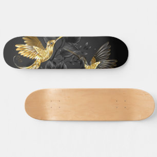 Skateboard Colibri noir et or