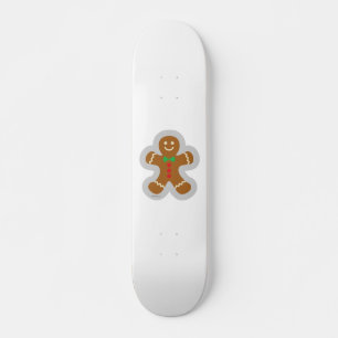 Skateboard Homme en pain d'épices faisant l'ange dans la neig