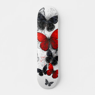 Skateboard Papillons noirs et rouges volants