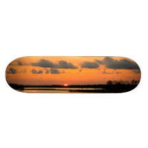 PLANCHE À ROULETTES ORANGE DE COUCHER DU SOLEIL