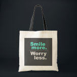 Smile More, Worless Less Sac fourre-tout - Spread<br><div class="desc">Éclairez votre journée avec ce sac fourre-tout stimulant avec l'expression inspirante "Smile more". Inquiète-toi moins.' Fabriqué à partir de matériaux de haute qualité,  ce sac fourre-tout est parfait pour l'utilisation quotidienne,  le shopping,  ou comme cadeau pour les amis et la famille qui apprécient un message positif."</div>
