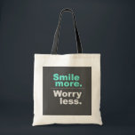 Smile More, Worless Less Sac fourre-tout - Spread<br><div class="desc">Éclairez votre journée avec ce sac fourre-tout stimulant avec l'expression inspirante "Smile more". Inquiète-toi moins.' Fabriqué à partir de matériaux de haute qualité,  ce sac fourre-tout est parfait pour l'utilisation quotidienne,  le shopping,  ou comme cadeau pour les amis et la famille qui apprécient un message positif."</div>
