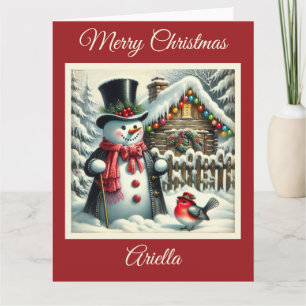 Snowman festif avec carte de Noël aux oiseaux roug