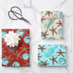Starfish Sea Horses Noël Cadeau Feuilles d'envelop<br><div class="desc">Papier d'emballage à thème de plage avec étoiles de mer et chevaux de mer. Chaque feuille a le même design mais en trois couleurs. Les ornements bleu aquatique, les étoiles de mer marron et les chevaux de mer bleus sont imprimés dans un motif plus grand sur le rouge foncé, le...</div>