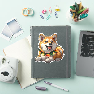 Sticker Akita mignon enveloppé dans des lumières de Noël