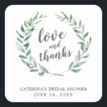 Sticker Carré Amour et Merci Rustic Wreath Fête des mariées Favo<br><div class="desc">Les autocollants de la douche de mariée à thème botanique arborent le message "Amour et Merci" à l'intérieur d'une couronne de verdure rustique avec des feuilles aquarellés avec votre nom, titre de l'événement et date, sur un arrière - plan blanc. Ces autocollants sont une excellente façon d'ajouter une touche personnelle...</div>