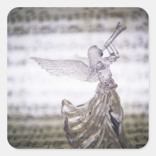 Sticker Carré Ange en verre jouant de la trompette et image de l
