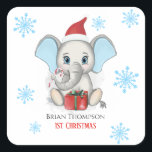 Sticker Carré Baby Boy First Christmas Jote Elephant Holidays<br><div class="desc">Un adorable petit éléphant avec un casquette de Noël,  un cadeau de Noël,  tenant un bonbon de canne de Noël et un arrière - plan enneigé avec de beaux flocons de neige. Bébé garçon Premières fêtes de Noël. Personnalisez en changeant le nom.</div>