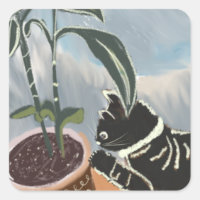Chat tigré regardant les plantes d'intérieur 