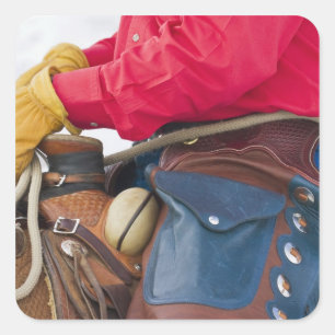 Sticker Carré Cow-boy à cheval portant des chaps en cuir