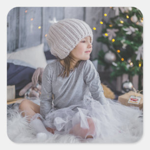 Sticker Carré Cute little child girl and the Christmas tree .jp