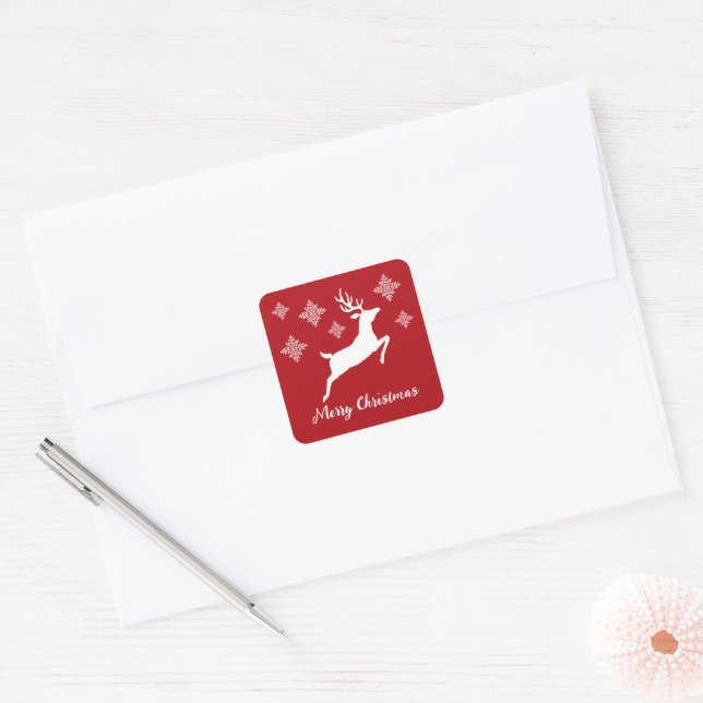 Sticker Carré Forme de cerf blanc sur fond rouge avec flocons de (Enveloppe)