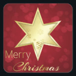 Sticker Carré Golden Christmas Star Red Bokeh<br><div class="desc">Une étoile dorée avec des flocons de neige sur un arrière - plan de bokeh rouge et Joyeux texte de script de calligraphie de Noël.</div>