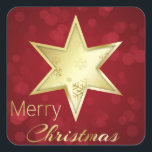 Sticker Carré Golden Christmas Star Red Bokeh<br><div class="desc">Une étoile dorée avec des flocons de neige sur un arrière - plan de bokeh rouge et Joyeux texte de script de calligraphie de Noël.</div>