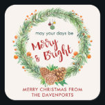 Sticker Carré Merry & Bright Christmas Wreath<br><div class="desc">Un autocollant de Noël personnalisé avec une couronne d'aquarelle. Seringues de pin vert,  cônes de pin et baies décoratives composent cette couronne festive. À l'intérieur de la couronne sont quelques ornements décoratifs et les mots" mai vos jours être Joyeux et lumineux. Écrit dans une police rouge tendance.</div>