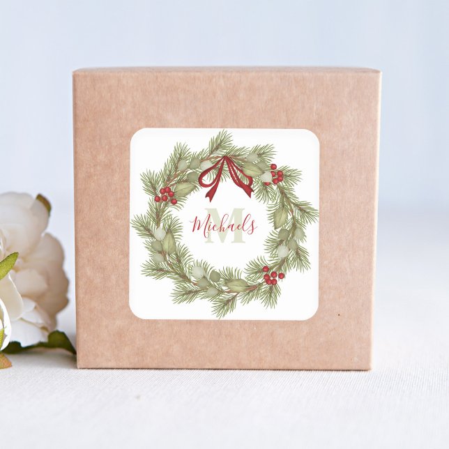Sticker Carré Noël Elégant Wreath Red Holly Monogramme (Christmas holiday greenery and red holly berries wreath with red ribbon sticker. )