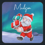 Sticker Carré Père Noël est en route Northern Lights Christmas<br><div class="desc">Père Noël est en route Northern Lights Christmas design personnalisé avec nom en écriture cool.</div>