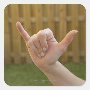 Sticker Carré Plan rapproché de la main d'une femme faisant un