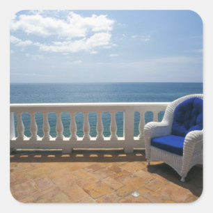Sticker Carré Porto Rico. Chaise en osier et terrasse carrelée à