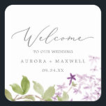 Sticker Carré Rustic Lilac Mariage Bienvenue<br><div class="desc">Ces autocollants rustiques mariage lilas de bienvenue sont parfaits pour un mariage de printemps ou d'été. Le design floral romantique et élégant présente des fleurs sauvages lilas violets d'aquarelle aux allures de jardin boho. Personnalisez ces autocollants avec l'emplacement de votre mariage, vos noms et votre date de mariage. Ces étiquettes...</div>