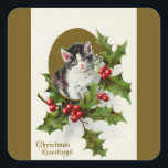 Sticker Carré Vintage Christmas Kitten Gold<br><div class="desc">Un chaton de Noël gris et blanc est encadré d'or avec du houx et des baies. Message : voeux de Noël. Image d'une carte postale Vintage sur un arrière - plan or personnalisé correspondant.</div>