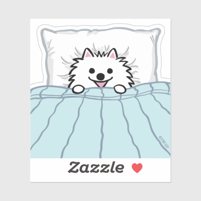 Sticker Chien adorable de Poméranie blanche couché dans un (Feuille)