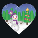 Sticker Cœur Hippie Christmas Snowman<br><div class="desc">Mignonne hippie bonhomme de neige portant un casquette violet, écharpe et lunettes de soleil avec des boutons de fleurs de signe de paix et une fleur de visage souriant sur son casquette. Derrière le bonhomme de neige se trouve une scène hivernale avec des arbres de Noël, de la neige et...</div>