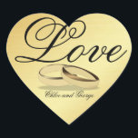 Sticker de coeur d'or personnalisé Love Mariage Ce<br><div class="desc">Un autocollant en forme de coeur d'or a Love écrit sur le dessus dans une belle police. Une paire de groupes mariages d'or ajoute à la romance. Les noms du couple mariage sont écrits sous les anneaux mariages. Le texte est facilement personnalisé pour votre usage personnel. Utilisez ces autocollants de...</div>