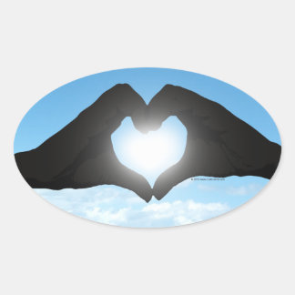 Sticker Ovale Mains en forme de coeur Silhouette sur ciel bleu