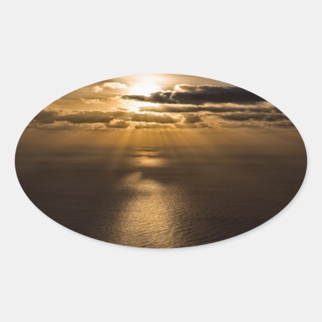 Sticker Ovale Sunrise above the Atlantic ocean (Devant)