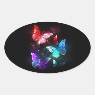 Sticker Ovale Trois papillons lumineux sur fond de nuit