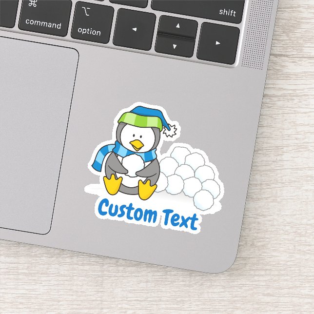 Sticker Petit pingouin assis avec des boules de neige (Détail)