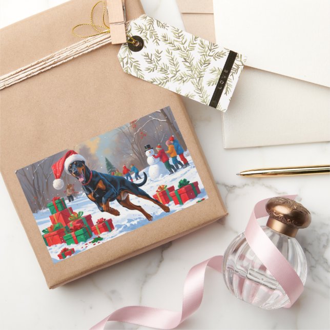 Sticker Rectangulaire Doberman courant dans la neige avec un chapeau de  (Cadeaux)